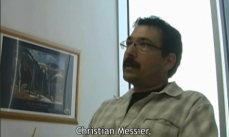 Photo of Christian Messier, director of the Centre for Forestry Research, at his desk