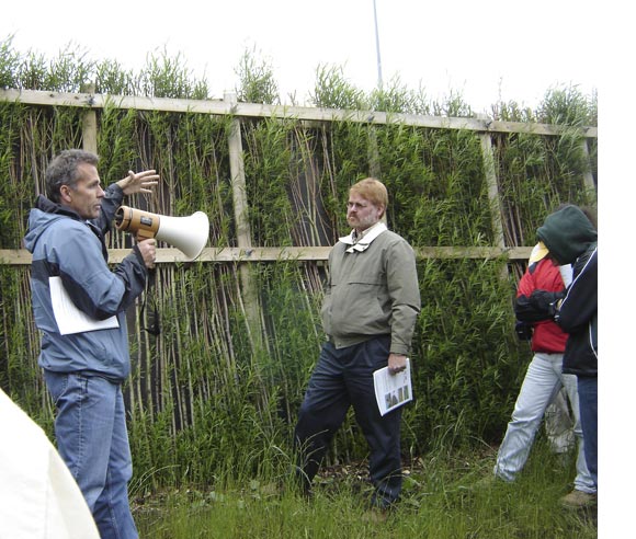 Photo of Michel Labrecque presenting a vegetal sound barrier wall