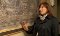 Photo of Céline Arseneault, coordinator of the exhibit Trees Inside Out, in front  of a map of the Jardin botanique de Montréal